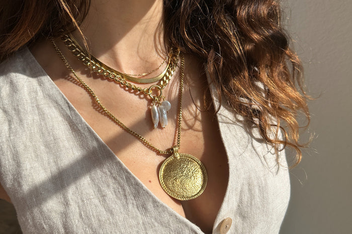Rachel Nathan Shield necklace shown on model